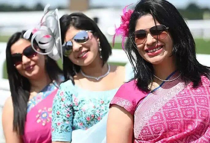 Group of women celebrate Indian weavers by wearing sarees at the Royal Ascot